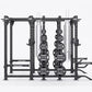 Black steel multi-station gym rack with weight plates and cable systems on white background