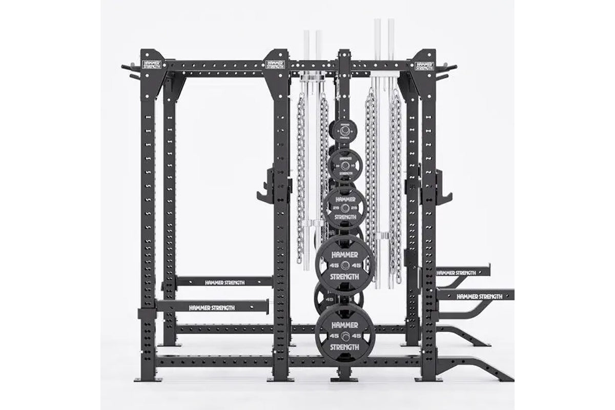 Black Hammer Strength HD Elite ID combo rack with weight plates, chains, and barbells on white background
