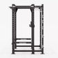 Hammer Strength HD Elite ID Power Rack with black steel frame, perforated uprights, white safety bars, and attachment arms on
