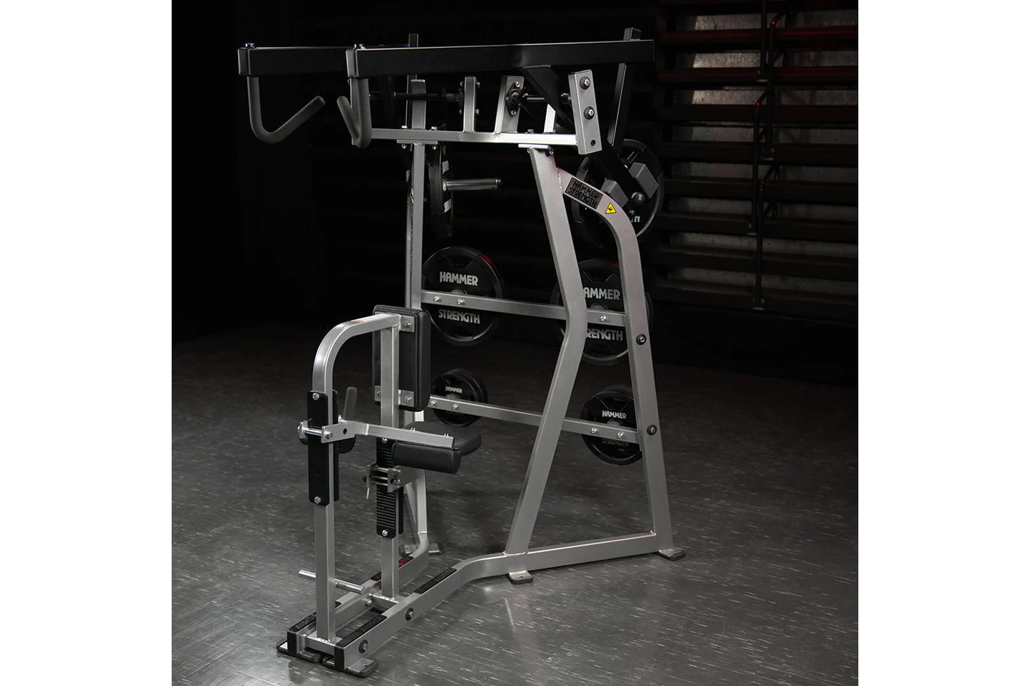 Hammer Strength Iso-Lateral High Row machine with silver frame and black weight plates on dark gym floor
