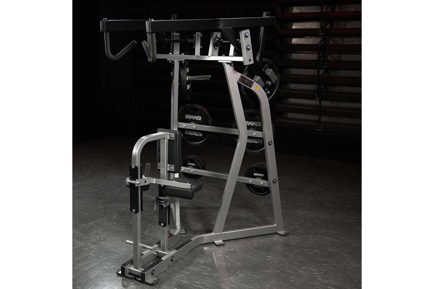 Hammer Strength Iso-Lateral High Row machine with silver frame and black weight plates on dark gym floor
