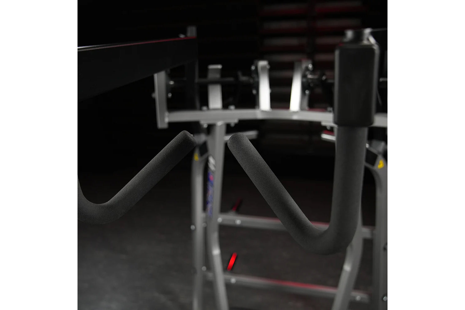 Hammer Strength Iso-Lateral High Row machine with gray steel frame and black padded handles in gym setting