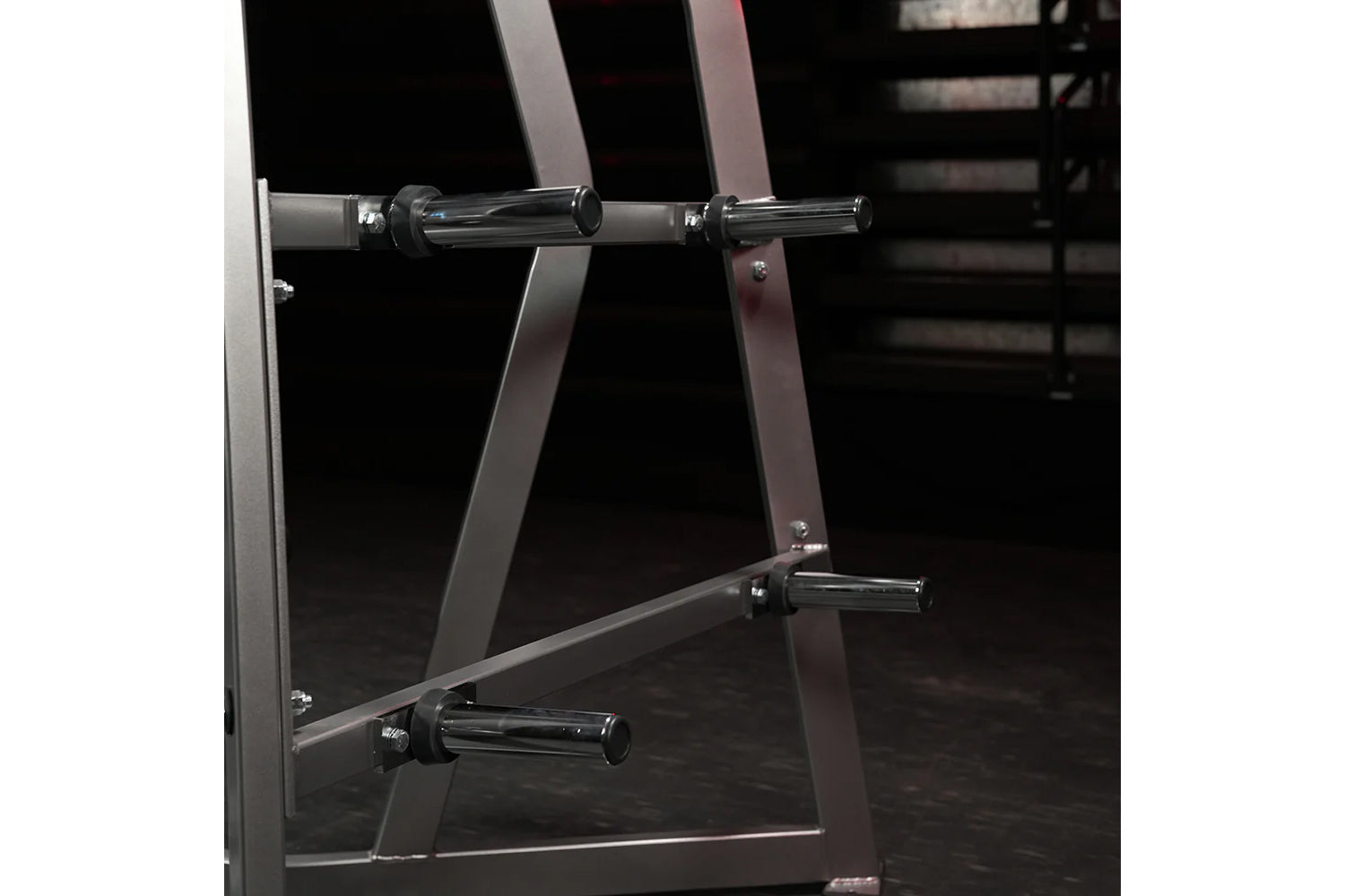 Hammer Strength Iso-Lateral High Row weight machine with chrome handles and black frame on dark gym floor