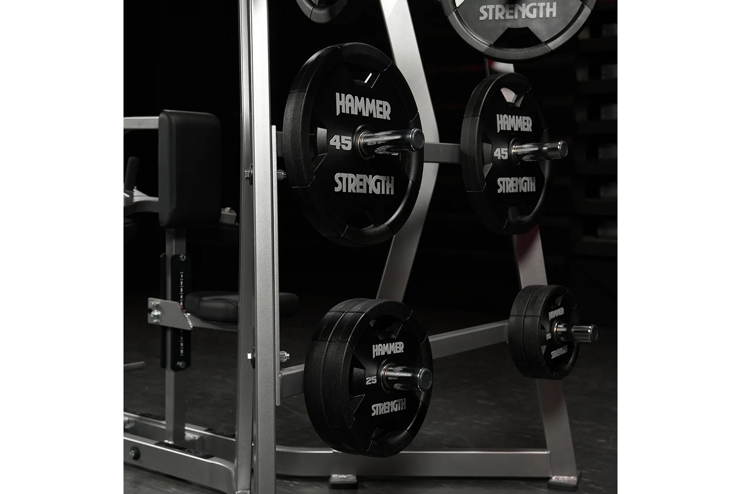 Hammer Strength Iso-Lateral High Row machine with black weight plates labeled 45 and 25 pounds, silver frame, in gym setting