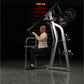 Hammer Strength Iso-Lateral High Row machine with gray and black frame, worn by male model in gym setting under red neon ligh
