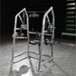 Hammer Strength plate-loaded 4-way neck machine with silver frame, weight plates, and footrest on gym floor