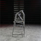 Hammer Strength plate-loaded 4 way neck machine with gray metal frame and multiple adjustment handles, on concrete floor