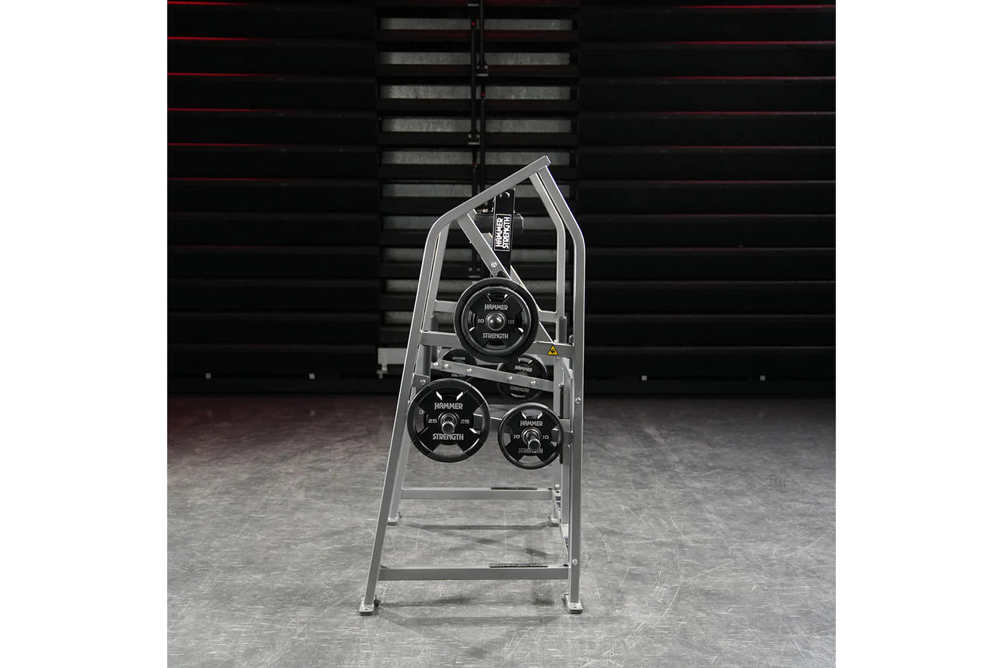 Hammer Strength plate-loaded 4-way neck machine with silver frame and black weight plates in gym setting