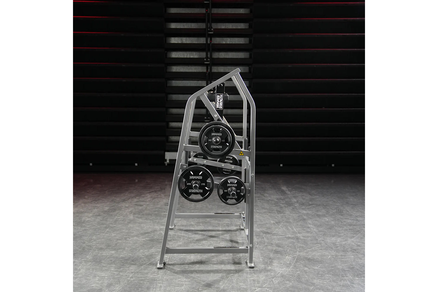 Hammer Strength plate-loaded 4-way neck machine with silver frame and black weight plates in gym setting