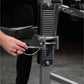 Man using black and chrome plate-loaded neck exercise machine with horizontal slatted backrest in gym setting
