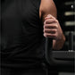 Person in black shirt gripping black foam-handled bar attachment on Hammer Strength neck exercise machine