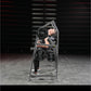 Man using gray Hammer Strength plate-loaded neck exercise machine with black weight plates in gym setting