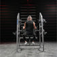 Athlete performing exercise on Hammer Strength plate-loaded neck machine with weighted plates in gym setting