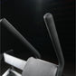 Hammer Strength plate-loaded abdominal oblique crunch machine with black handles and padded seat, on dark background