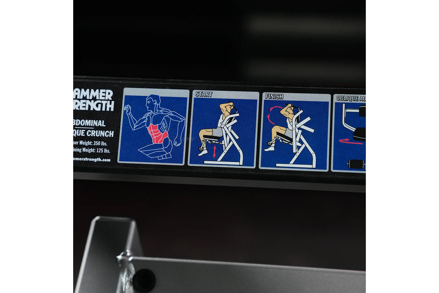 Hammer Strength plate-loaded abdominal crunch machine with instruction decals showing exercise form on blue background