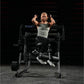 Woman performing abdominal oblique crunch exercise on black Hammer Strength plate-loaded machine in gym setting