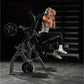 Woman using black plate-loaded abdominal oblique crunch machine in gym setting, wearing silver sports top and black leggings