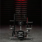 Hammer Strength plate-loaded combo twist machine with black weight plates, curved handles, and red steel frame in gym setting