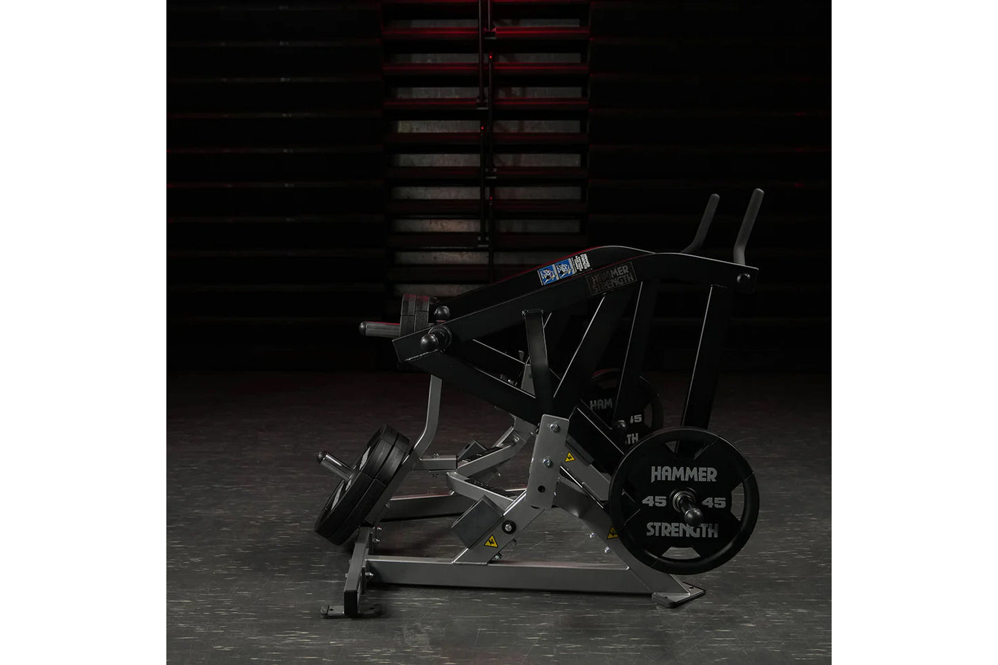 Hammer Strength plate-loaded combo twist machine with black frame, dual handles, and 45-pound weight plate loaded, in gym set