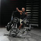 Man using black and silver Hammer Strength plate-loaded combo twist machine with loaded weight plates in gym setting