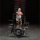 Man wearing gray t-shirt and tan shorts performing a twist exercise on black Hammer Strength plate-loaded machine in gym sett