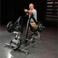 Man using gray and black Hammer Strength plate-loaded combo twist machine with weighted plates in gym setting