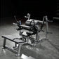 Hammer Strength plate-loaded glute drive machine with silver frame, black padded seat and back support, on gym floor