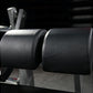 Pair of black leather cylindrical leg press pads on Hammer Strength fitness equipment