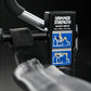 Hammer Strength Glute Drive plate-loaded machine with black box packaging and blue instructional graphics, surrounded by weig