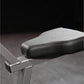 Black padded vinyl seat with chrome base on dark background, detail view of Hammer Strength Plate-Loaded Gripper