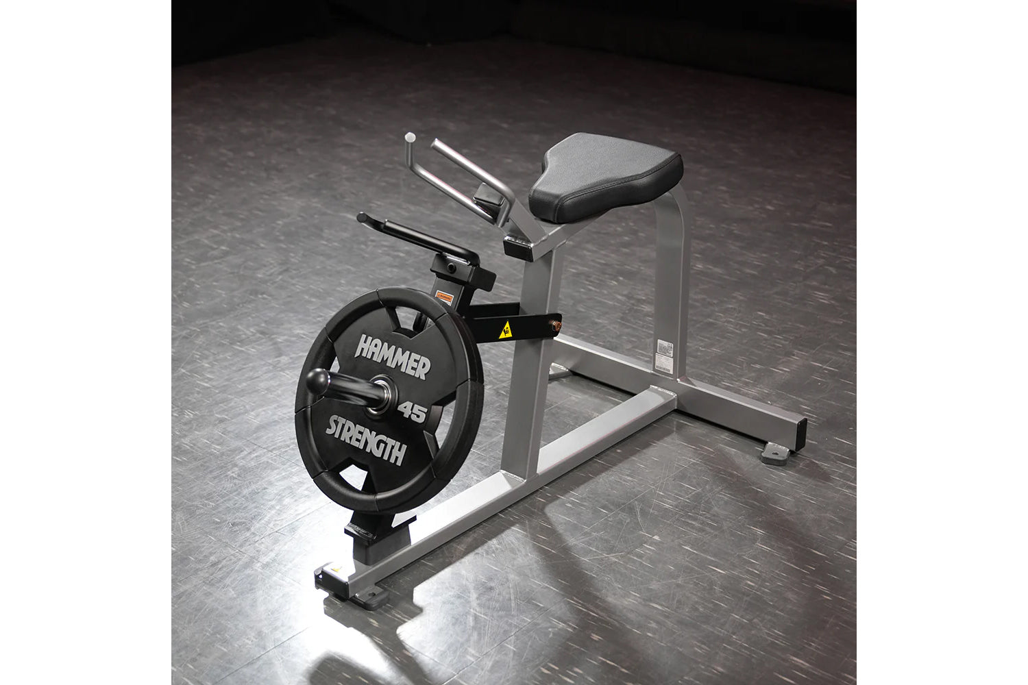 Hammer Strength plate-loaded gripper with 45-pound black weight plate, gray frame, and padded seat on gym floor