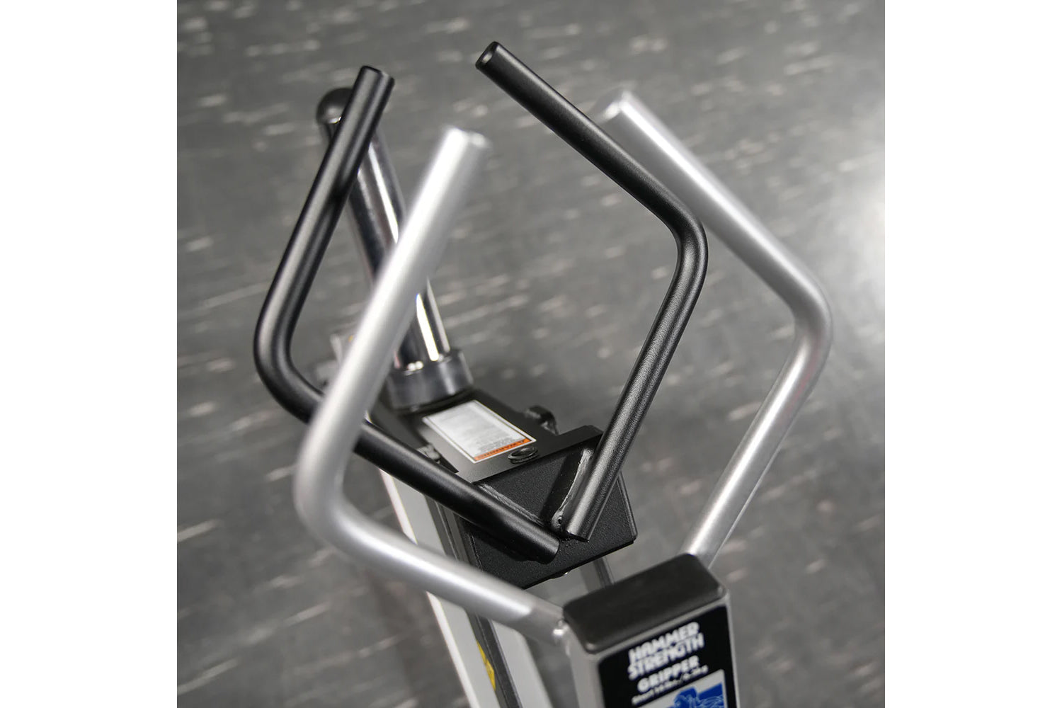 Hammer Strength plate-loaded gripper machine with dual black and silver handles on gray textured background
