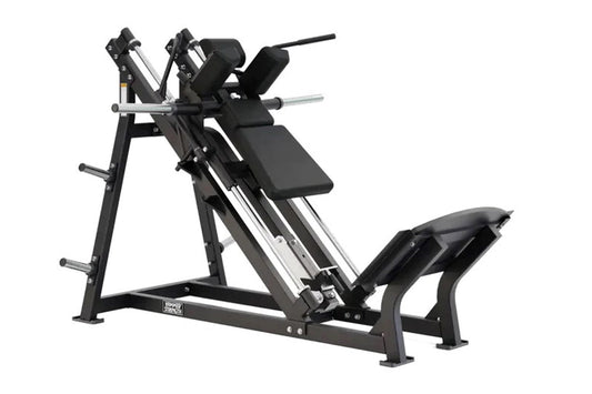 Hammer Strength plate-loaded hack squat machine with black steel frame, padded backrest and foot platform, on white backgroun