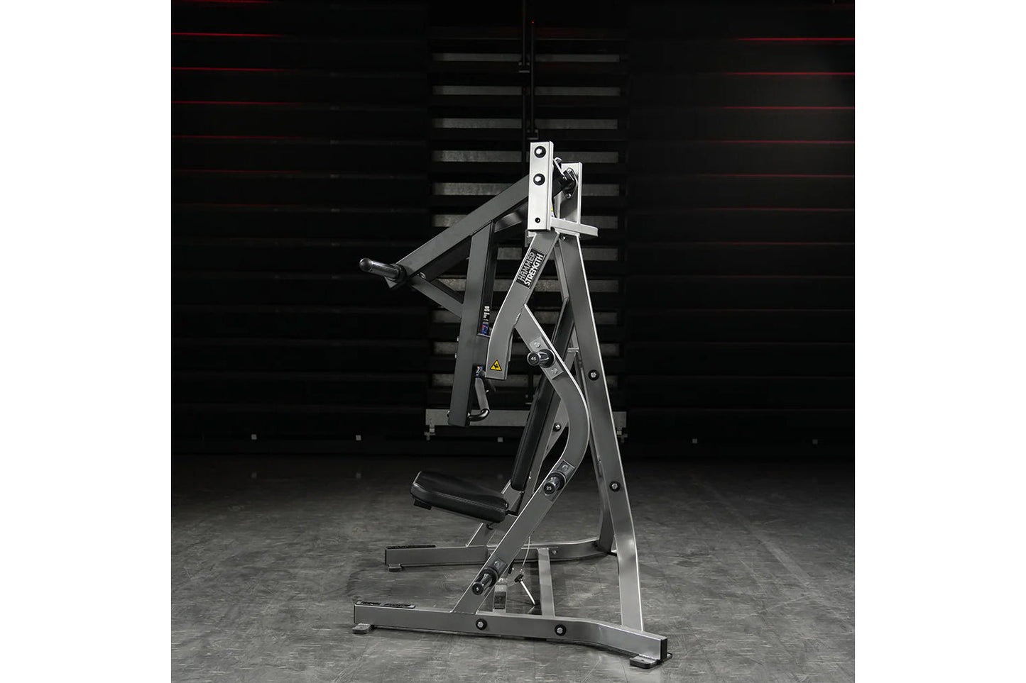 Hammer Strength plate-loaded iso-lateral bench press machine with black and white frame, padded seat, and dual weight plate p