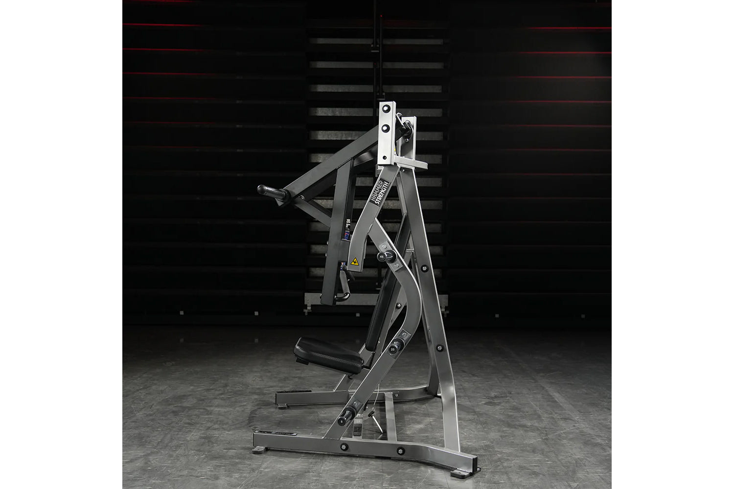 Hammer Strength plate-loaded iso-lateral bench press machine with black and white frame, padded seat, and dual weight plate p