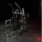 Hammer Strength plate-loaded iso-lateral chest/back machine with silver frame, black seat, and loaded weight plates on dark g