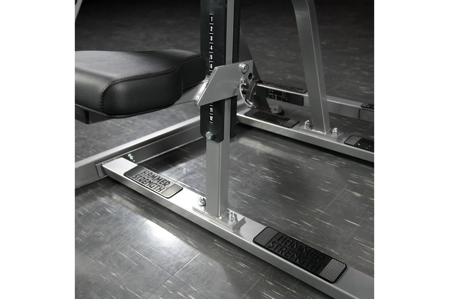 Hammer Strength plate-loaded iso-lateral D.Y. row machine with black padded seat, silver frame, and adjustment lever in gym s