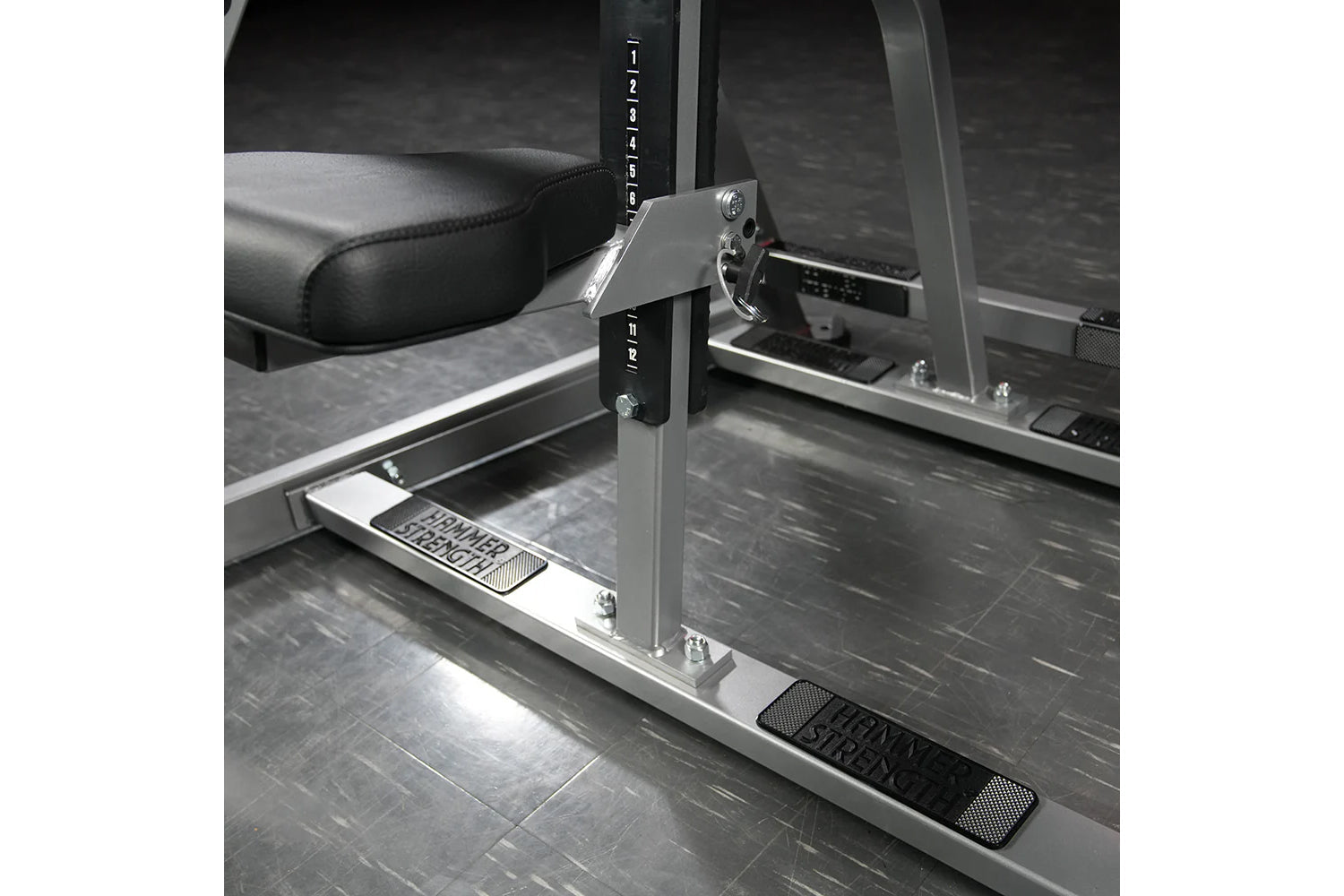 Hammer Strength plate-loaded iso-lateral D.Y. row machine with black padded seat, silver frame, and adjustment lever in gym s