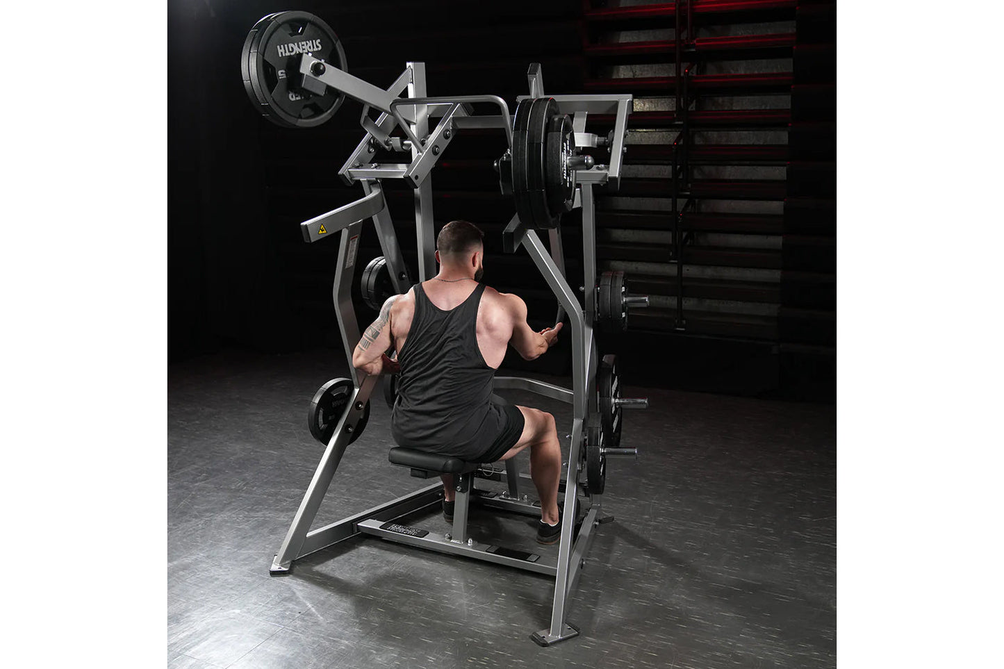 Hammer Strength plate-loaded iso-lateral dual-axis row machine with gray frame and black weight plates, shown in gym setting 