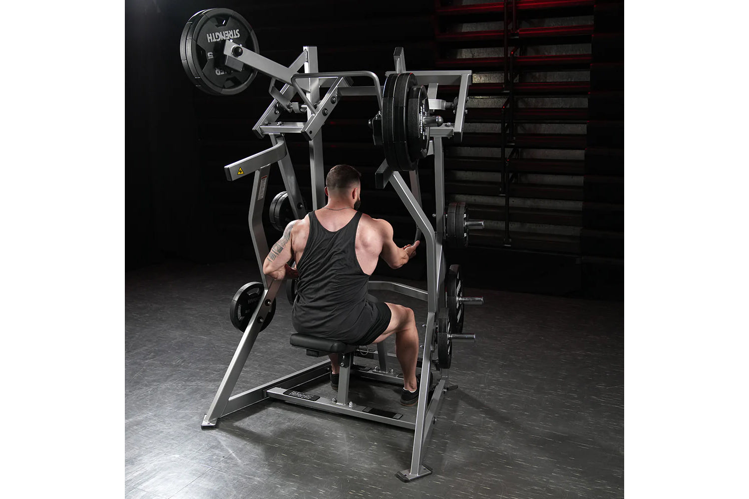Hammer Strength plate-loaded iso-lateral dual-axis row machine with gray frame and black weight plates, shown in gym setting 