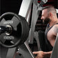 Man using Hammer Strength plate-loaded iso-lateral row machine with black weight plate, commercial gym equipment