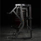 Black plate-loaded iso-lateral decline chest press machine with gray frame and padded seat, shown on dark background