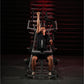 Man using black and red Hammer Strength plate-loaded lat pulldown machine, performing front pull exercise in gym setting