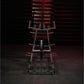 Hammer Strength plate-loaded iso-lateral front lat pulldown machine with black and red frame, viewed from front on dark backg
