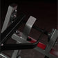 Hammer Strength plate-loaded iso-lateral horizontal bench press with gray metal frame and red padded seat on black background