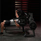 Man performing chest press on black Hammer Strength plate-loaded bench with weight plates, in gym setting
