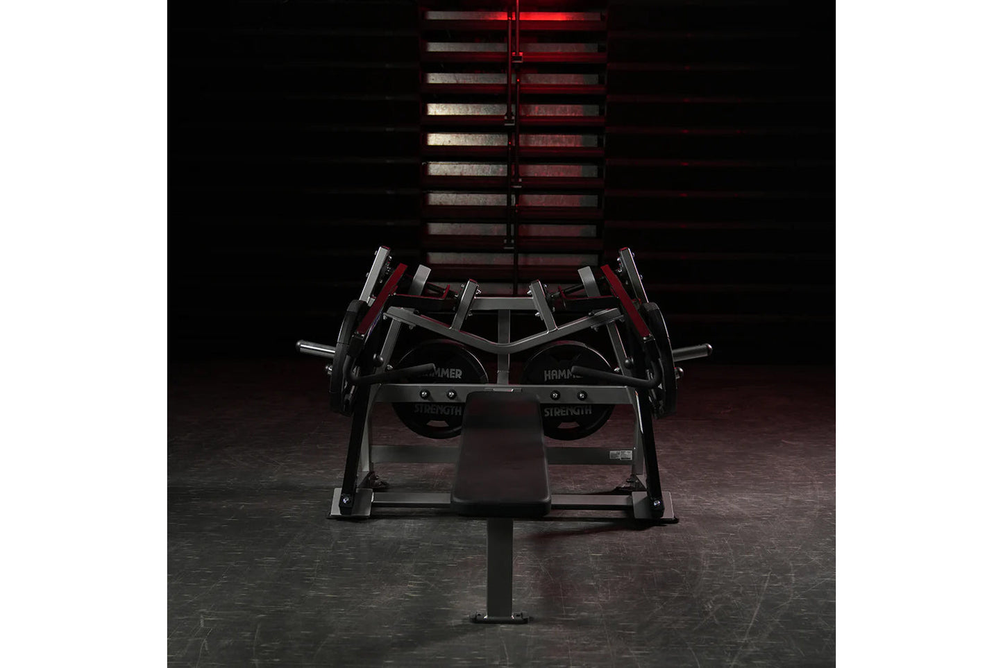 Hammer Strength plate-loaded iso-lateral horizontal bench press with black frame, red accents, and dual independent arms in g