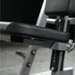 Black leather padded handle on weight training machine with gray metal frame and adjustment mechanisms