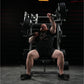 Man performing incline chest press on black Hammer Strength plate-loaded machine in gym setting