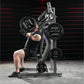 Man performing incline chest press on Hammer Strength plate-loaded machine with black weight plates in gym setting